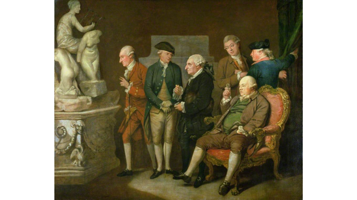 A painting of well-dressed 18th century gentlemen examining three classical sculptures—two nude and one clothed female—in an interior setting. Each man appears to have at least one hand positioned suggestively in a pocket, over the upper portion of the trousers, or gripping a nearby object.